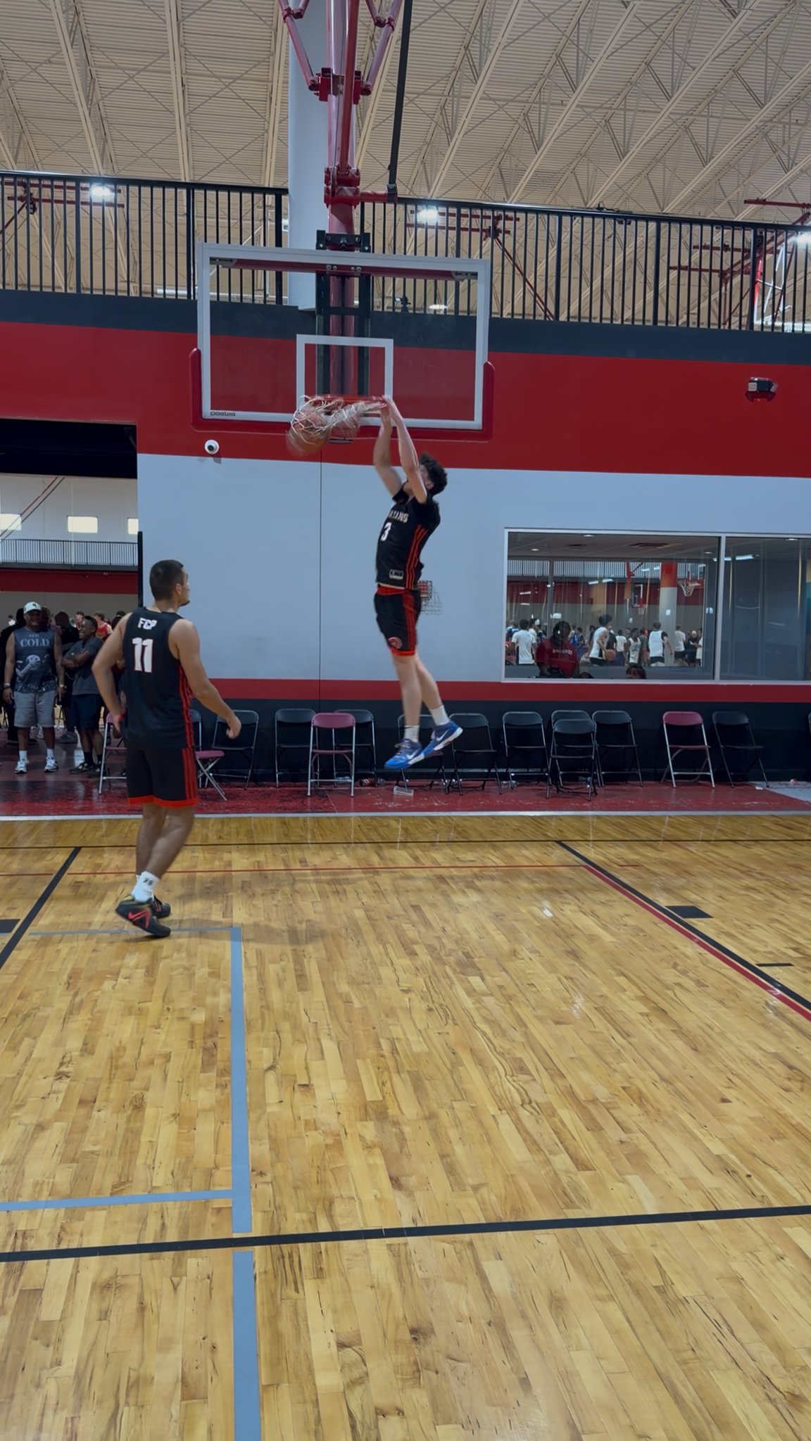 FCP player dunking at the All-American Jamboree in Orlando