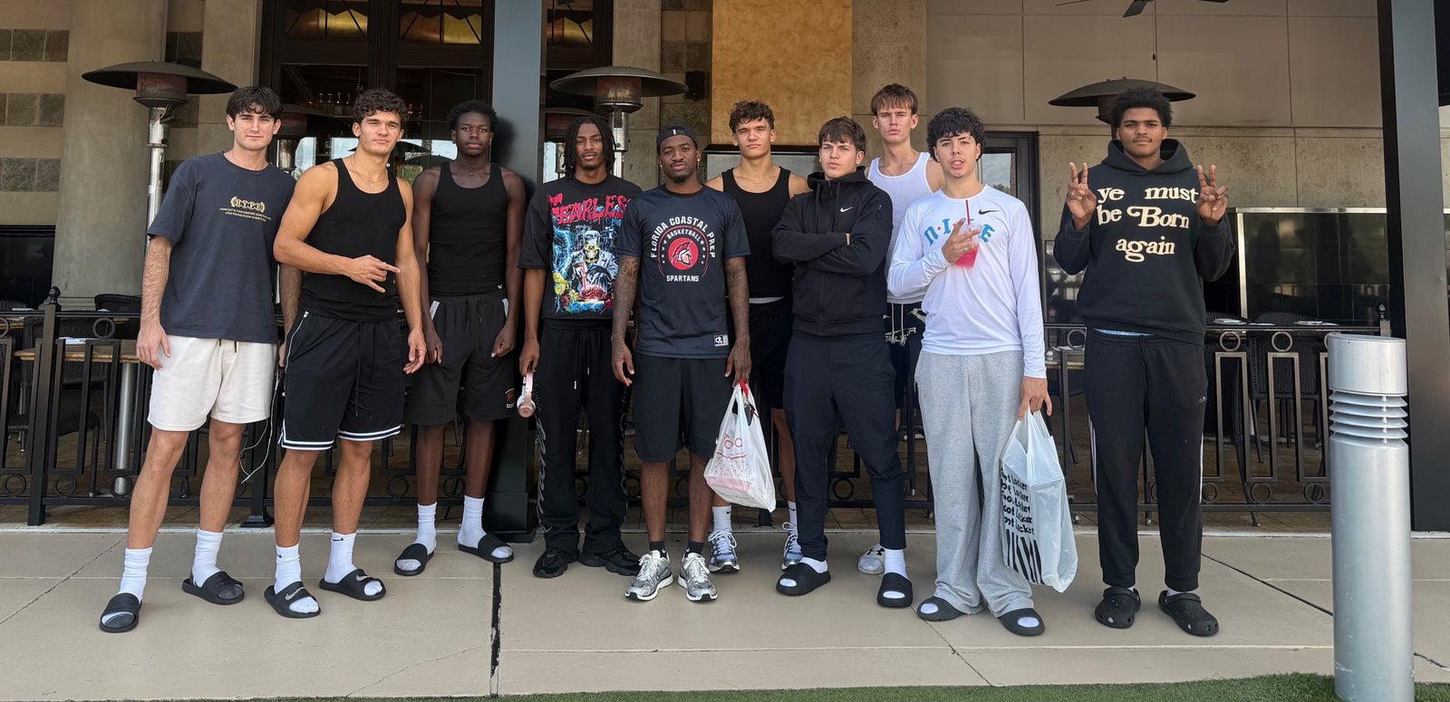 Coach Tyler and the FCP Orlando group standing together outside before the All-American Jamboree in Orlando
